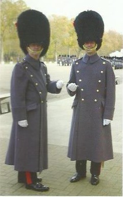 Graham handing the conductor’s baton to his successor, Major Darren Wolfendale, both in Coldstream Guards uniform